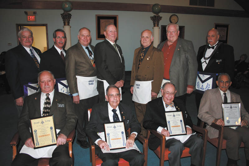 Argus Lodge 545 of Canfield recently honored some of its members for outstanding service. Pictured from left to right, sitting, are Emanuel Cominos, David R. Gundry, Arthur T. Gundry and Robert W. Luth. Standing are John Martin, Douglas F. Anstrom, Eric R. Cahalin, James R. Brown, Laszlo D. Dundics, Ronald W. Martin and Thomas J. Hallden.