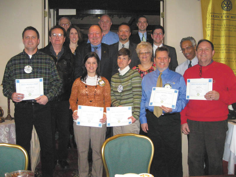 Austintown Rotary President Deanna Spirko recently presented certificates acknowledging three months of perfect attendance to 16 members, almost half of the club membership. Recipients of the award are, left to right, front row, Spirko, Hillary Prestridge, Robin Stock, Karl Rein, Ram Kasuganti and Gary Reel. Middle row: Brian Frederick, Ron Carroll, Jen Connolly, Chuck Baker, Mark Cole and Mitch Dalvin. Back row: Tony Cebriak, Mal Culp and Brian Laraway. Absent from the picture is Jerry Haber.