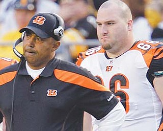 Cincinnati Bengals offensive lineman Mike McGlynn (66) stands on the sidelines with coach Marvin Lewis during the fourth quarter of a game against the Pittsburgh Steelers. McGlynn is a free agent this off season.