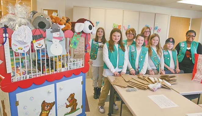 The junior Girl Scouts of Liberty-based Troop 80055 donated craft kits Monday to Akron Children’s Hospital Mahoning Valley in Boardman. Pictured in the front row, from left, are Julia Sammartino, Rebecca Horn, Gwen Carlson, Zoe Franklin and London Hairston. In the back row, from left, are Brittany Horn, Kaylin Johnson and Kimberly McCann.