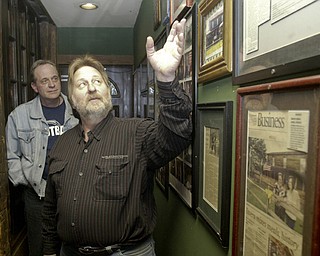 John Palasics, owner of The Lake Tavern, showing off the history of the building to Jerry Tranovich of the Mahoning Valley Burger Review Board.
