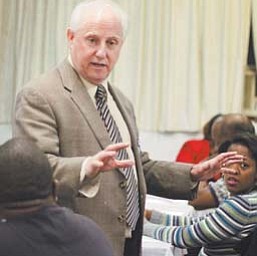 Greg Galluzzo, founder and senior organizer of the Chicago-based Gamaliel Foundation, speaks to a
group of concerned parents and residents at the Save Our Schools meeting at Elizabeth Missionary
Baptist Church in Youngstown on Tuesday night.