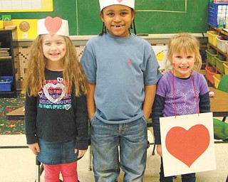 Kindergarten students in Mrs. Bond’s class at St. Patrick School in Hubbard acted out the classic children’s nursery rhyme, “The Queen of Hearts” as part of their Valentine’s Day celebrations. Classmates recited the verse while others took turns at the acting. Participating were, left to right, Ava Lengyel, Anthony Carter and Lauren Murcko.