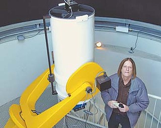 Astronomy professor Daniel Caton stands by a low-light video camera at the campus observatory at Appalachian State University in Boone, N.C. He is hoping to use the cameras to capture a phenomenon known as the Brown Mountain lights.