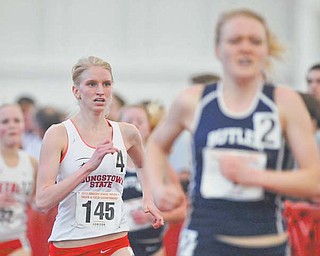 Youngstown State’s Samantha Hamilton, a graduate of Jackson-Milton High, runs to the finish line behind Butler’s Katie Clark to place second in the 3,000-meter run in the Horizon League indoor track championships Sunday at YSU.