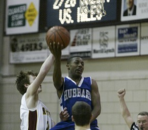 William d Lewis the vindicator Mooney's George Brandenstein tries to block Darnell Tate of Hubbard during Monday action at Boardman.