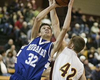William d Lewis the vindicator  Mooney's Doug Caputo tries to block Kirby Knutson of Hubbard during Monday action at Boardman.