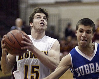 William d Lewis the vindicator Mooney's Ryan Farragher shoots over Nick Shelton of Hubbard during Monday action at Boardman.