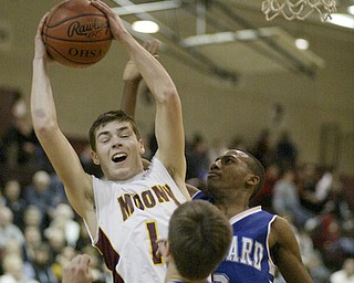 William d Lewis the vindicator Mooney's Drew Beck pulls down a rebound past Darnell Tate of Hubbard during Monday action at Boardman.