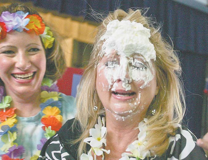 Debbie Calcagni, kindergarten teacher at Watson Elementary in Austintown, took a pie to the face Friday during a special assembly for the students. Calcagni was one of 10 teachers to be pied as a “thank you” to the student body, which raised money during a three-weeklong campaign for Pennies for Patients.