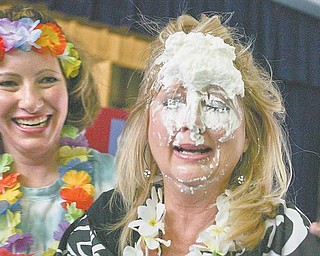 Debbie Calcagni, kindergarten teacher at Watson Elementary in Austintown, took a pie to the face Friday during a special assembly for the students. Calcagni was one of 10 teachers to be pied as a “thank you” to the student body, which raised money during a three-weeklong campaign for Pennies for Patients.