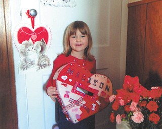 Madison Wright is showing off the valentine box she and her daddy, Jesse, made together. Photo taken by her grandma, Marilyn Cavanaugh of Columbiana.