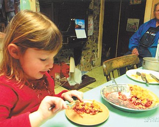 Madison Wright is enjoying a piece of cherry pie as her great granddad, John Kellner, watches to a make sure she doesn't eat it all. Photo taken by her grandma, Marilyn Cavanaugh of Columbiana.