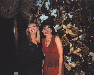 Deborah Carissimi of Boardman, in red, is pictured with her sister Carla.