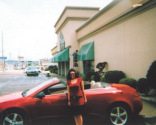 Deborah Carissimi of Boardman shows off her 2007 Pontiac G6 convertible.