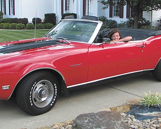Annika Lazazzera-Swanson is checking out her dad's '68 Camaro. Picture taken by Melinda lazazzera of Canfield.