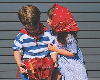 Back in 1995, Laine Vicarel tried to get a smooch from Patrick Krieger. Both were age 5. They are first cousins and the grandchildren of Michael Lacivita of Youngstown.