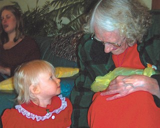 Great-grandma Edith Kellner shares a moment with great-granddaughter Lydia V. May, who was 10 months old when this photo was taken Christmas Eve 2011. Lydia's mother, Debbie, is in the background. Photo sent in by Grandma Evelyn.