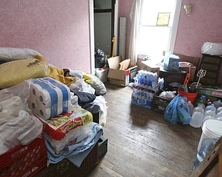 JESSICA M. KANALAS | THE VINDICATOR..Blake uses one of his four bedrooms on the second floor to store all of the community's donations. He said he has more than enough and can't believe the goodness of the people in the area.