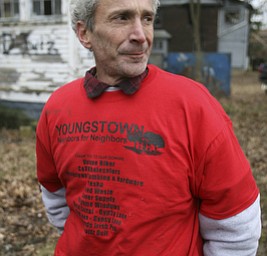 JESSICA M. KANALAS | THE VINDICATOR..Rik Blake, new to the North side, wheres one of 100 t-shirts donated to the Youngstown Neighbors for Neighbors group.