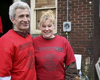 JESSICA M. KANALAS | THE VINDICATOR..Blake and volunteer Connie Lauderdale, who helped organize the work day, stand in the backyard where volunteers from the community came to clean up despite the brisk wind and cold temperatures.