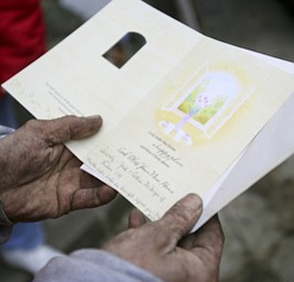 JESSICA M. KANALAS | THE VINDICATOR..Blake, despite his dirty hands, makes sure he opens every card and reads every message sent his way. Here a couple from Lisbon sent over two cases of bottled water and a card with sentiments for blessing a new home.