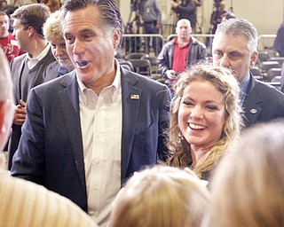 ROBERT K. YOSAY|THE VINDICATOR..Abbie Horman asenior from Fitch =- and Mitt mug for a friends camera ---.Mitt Romney, one of the front-runners for the Republican presidential bid, was the first of the GOP candidates to campaign in the Mahoning Valley. @ Taylor Winfield plant on Salt Springs Rd... ...-30-