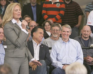 ROBERT K. YOSAY|THE VINDICATOR..Ann Romney speaking to the crowd as Mitt and Ron Portman share a laugh - Mitt Romney, one of the front-runners for the Republican presidential bid, was the first of the GOP candidates to campaign in the Mahoning Valley. @ Taylor Winfield plant on Salt Springs Rd... ...-30-