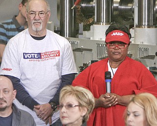 ROBERT K. YOSAY|THE VINDICATOR.Bill Catlin of Lordstown - and ---(dave has name) listen to the response by Mitt ---.Mitt Romney, one of the front-runners for the Republican presidential bid, was the first of the GOP candidates to campaign in the Mahoning Valley. @ Taylor Winfield plant on Salt Springs Rd... ...-30-