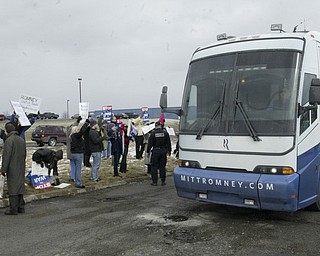 William D Lewis the Vindicator A small gropup of Obamasupporters protest as Mitt Romney's bus arrives for Monday 3-5-12 event in Youngstown.