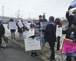 William D Lewis the Vindicator A small gropup of Obamasupporters protest as Mitt Romney's bus arrives for Monday 3-5-12 event in Youngstown.