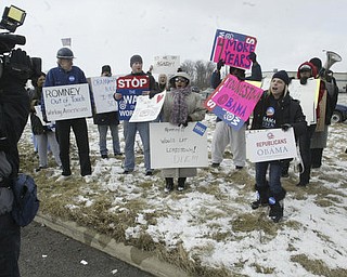 William D Lewis the Vindicator A small gropup of Obamasupporters protest as Mitt Romney's bus arrives for Monday 3-5-12 event in Youngstown.
