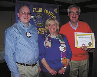 Boardman Lions Club had its Valentine Dinner on Feb. 9 at the Saxon Club in Austintown. Bill Rausch, at left, zone chairman of District 13-D, installed a new member, Gary Sobotka, right, sponsored by Lion Laura Hancock.
