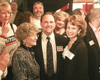 Austintown Trustee David Ditzler enjoys his victory as a Mahoning County commissioner Democratic nominee at the B&O Station. He celebrated Tuesday with his mother, Emogene, left, and wife, Jenny.
