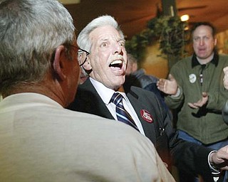 Mahoning County Prosecutor Paul Gains celebrates his winning re-election during a gathering Tuesday
night at Cafe Cimmento. Gains narrowly defeated challenger Jay Macejko, who had the county Democratic
Party central committee endorsement, to win a fifth term.