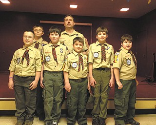 Seven cub scouts from Webelo 2, Den 5, The Blue Wolves Den, recently participated in a crossover ceremony at the annual Blue and Gold Banquet for Cub Scout Pack 9022 at Calvary Baptist Church in Boardman. The boys who crossed over into the Boy Scout Troop are, left to right, front row, Juan Gomez, Justin Long, Anson Hankey, Alex Mazon and David Santangelo. In the back row are Michael Gombas and Den Leader Dave Santangelo, Absent is Zach Eckert. Zach, Juan, Anson, Justin, Alex and David received their Arrow of Light Award, the highest award that a Cub Scout can earn, and they also earned the “Super Achiever” award.