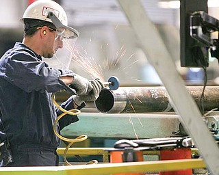 Mike Christoff is one of 71 workers at TMK-IPSCO in Brookfi eld. The company threads pipe for use in the natural gas and oil drilling
industry. TMK-IPSCO plans to expand its work force to 120 to meet growing demand for the steel pipes.
