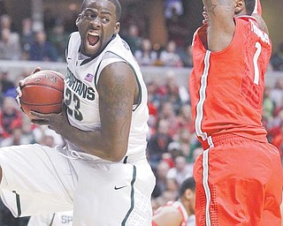 Michigan State forward Draymond Green (23) grabs a rebound against Ohio State forward Deshaun Thomas (1) in the Men’s NCAA Big Ten Conference basketball final Sunday in Indianapolis. The Spartans defeated the Buckeyes, 68-64, for their first Big Ten title since 2000.
