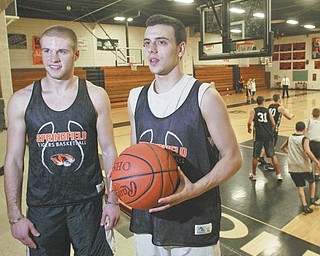 Springfield basketball seniors Ryan Stacy, left, and Tommy Mastran were in third grade the last time the Tigers won a district title. They will try to help the Tigers defeat Bedford Chanel in Wednesday’s Division III regional
final at the Canton Fieldhouse.