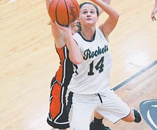 Emily Carlson (14) of Lowellville has been named to the Associated Press All-Ohio first team in girls basketball for Division IV. She averaged 14.7 points per game for the Rockets.