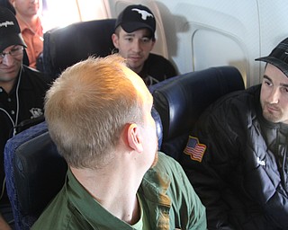 NewsOutlet Student Editor Doug Livingston, left, interviews Sean Nagel Mueller, 27, of Victoria, Texas. Mueller was flying home after working his regular two-week stint with an oil company in Pennsylvania.