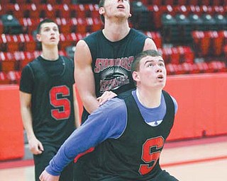 Struthers basketball players, including Austin Grewe, front, practice at Struthers High School. The Wildcats face Mentor Lake Catholic in the Division II regional semifinal tonight at Canton Civic Center.
