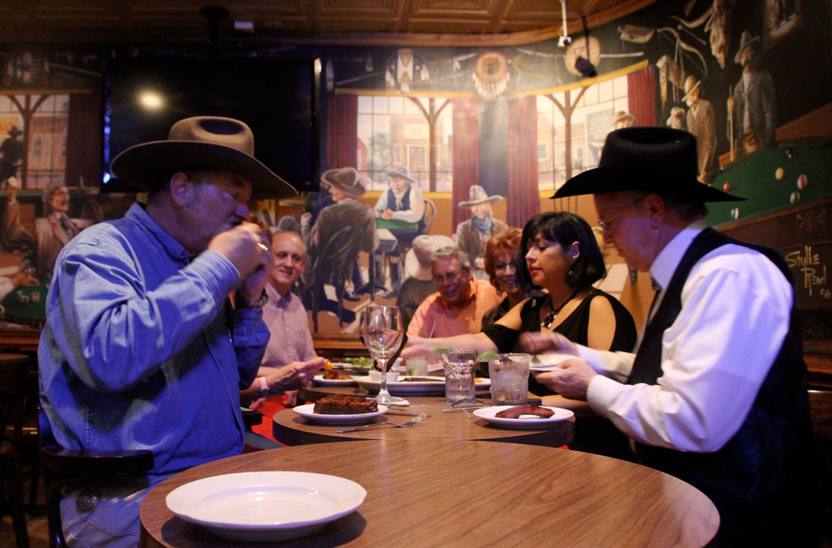 Jack Edmondson, left and Ken Morgan, right, of Fort Worth, along with a handful of friends, enjoyed dinner Wednesday night at Cattlemen's Steakhouse in the city's Historic Stockyards District. The group gets together weekly to discuss the area's hot topics, which often consist of the Barnett Shale, a major natural-gas geologic formation. Wednesday's topic focused on natural-gas vehicles.