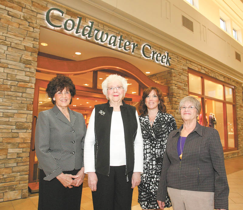 ROBERT K. YOSAY | THE VINDICATOR: The Garden Forum of the Greater Youngstown Area is preparing for its annual spring luncheon and fashion show in April. Committee members, from left, Louella Friend of Moccasin Garden Club; Charlene Flesch, second vice president of the Garden Forum; and, far right, Garden Forum President Mary Shall, stand with Kim Ahladis of Coldwater Creek outside the clothing store at the Eastwood Mall. The store is presenting the fashion show at the event.