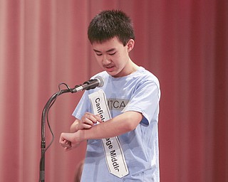 ROBERT  K.  YOSAY  | THE VINDICATOR --..I ARM -  Max Lee from Canfield Village Middle School  uses his forearm to visual words as he spelled them -  He eventually won the bee-.The 79th  Regional Spelling Bee sponsored by the Vindicator was held at YSU Kilcawley Center with 65 spellers vieing for the coveted trophy and trip to Washington for the National Spelling Bee s--30-..(AP Photo/The Vindicator, Robert K. Yosay)