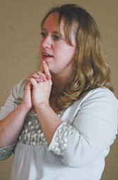 Jennifer Miller, education coordinator of Greater East Ohio Area Chapter of the Alzheimer’s Association,
questions participants at a program Tuesday at Greenford Christian Church on solutions to everyday problems encountered by Alzheimer’s patients.