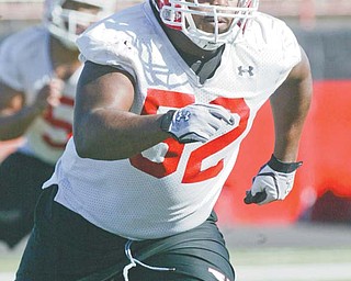 Youngstown State senior DT Aronde Stanton runs drills during practice Wednesday at YSU’s Stambaugh Stadium. It was the Penguins’ first spring practice and the first with new defensive coordinator Joe Tresey, who is night-and-day different than former DC Rick Kravitz.