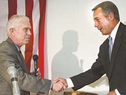 House Speaker John Boehner, right, and U.S. Rep. Bill Johnson of Marietta, R-6th, exchange greetngs at the GOP headquarters in Boardman.