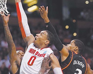 Ohio State forward Jared Sullinger (0) shoots against Cincinnati defenders, including Dion Dixon (3) and
Justin Jackson (5), in the first half of Thursday’s East Regional semifinal in the men’s NCAA basketball tournament in Boston. The Buckeyes pulled away from the Bearcats late in the second half for an 81-66 win.