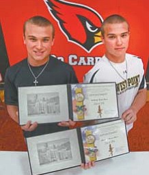 Anthony, left, and Michael Ross, 18, of Canfield signed their appointment papers Thursday to attend the U.S.
Military Academy at West Point. The identical twins will report to the academy in July for six weeks of basic training before beginning their academic and military careers.
